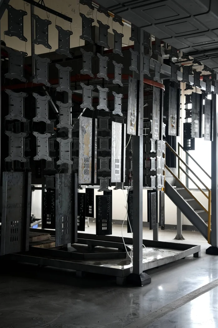 Powder coating operation for metal components